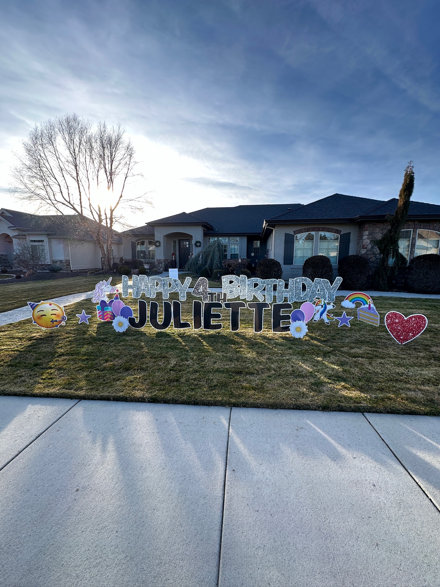 Happy 4th Birthday Juliette yard card display with bright letters and party art on a Boise lawn