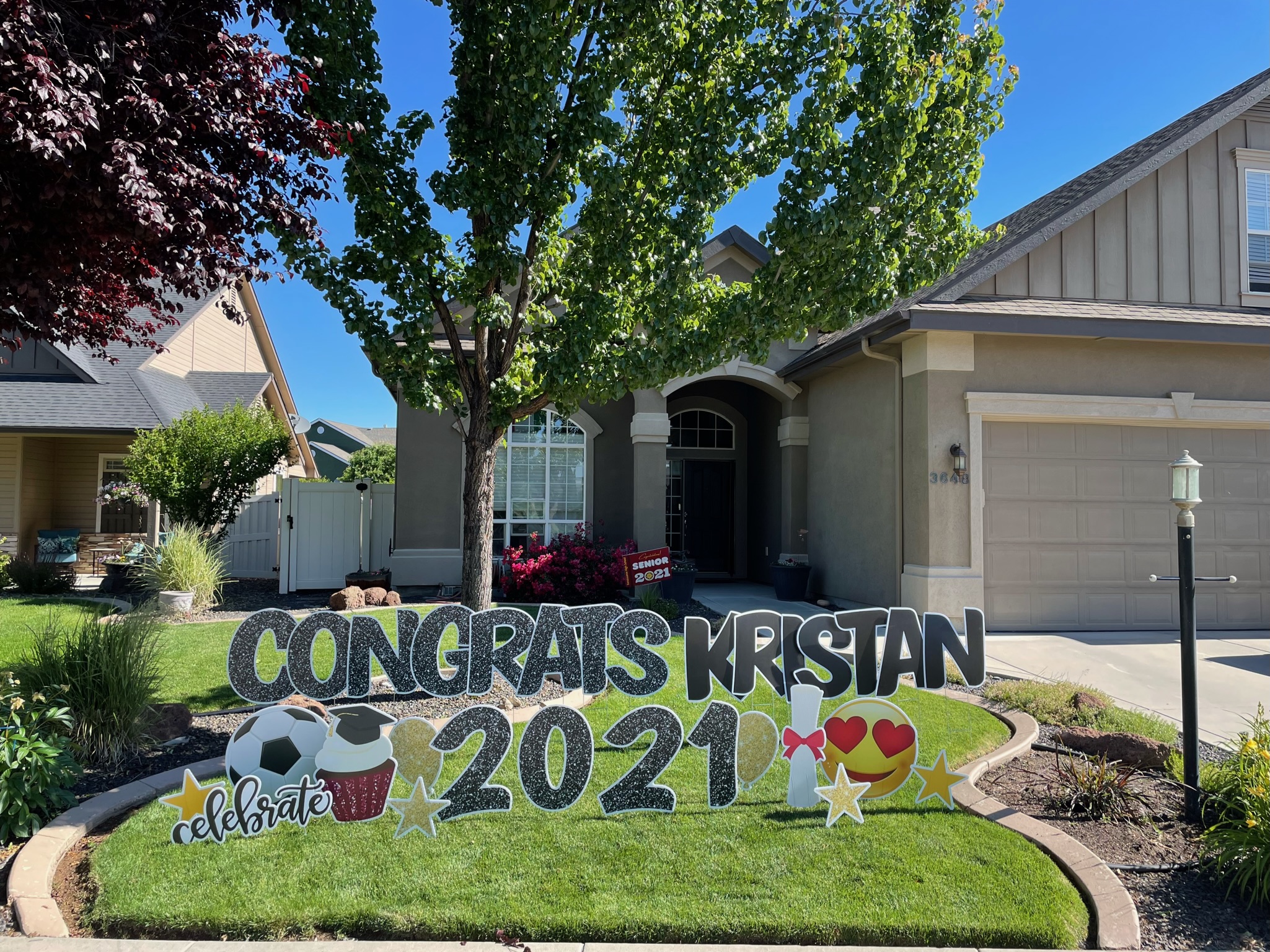 Congratulations Kristan graduation yard card display with cap and diploma art in Boise Idaho