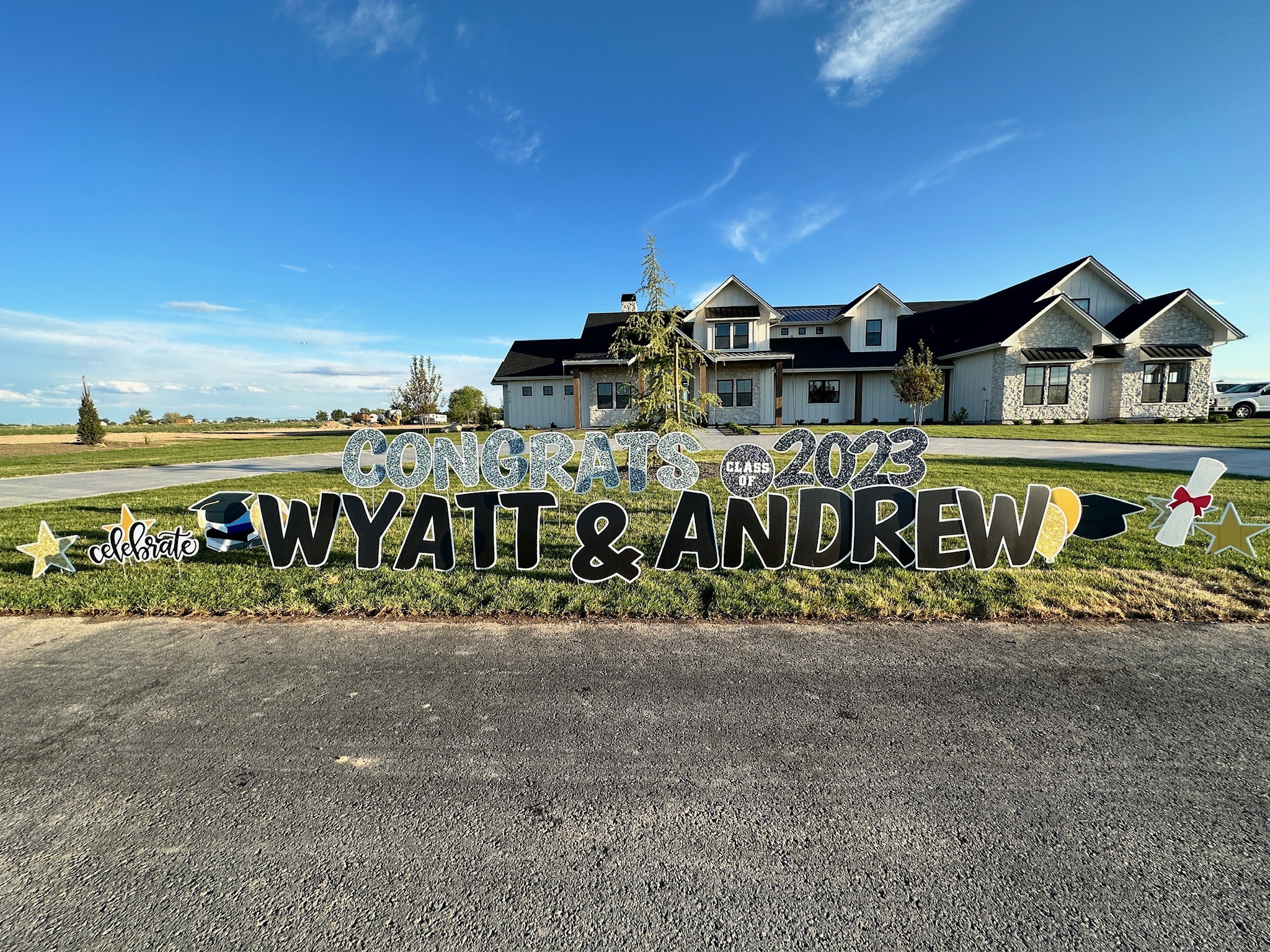 Congrats Wyatt and Andrew Class of 2023 double name graduation yard card display on a large Boise Idaho property